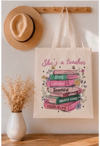 🍎📚 She's a Teacher – Inspirierende Teacher Tote Bag